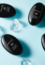 BLANC DUBU black sunscreen bottles on a cooling blue backdrop with ice