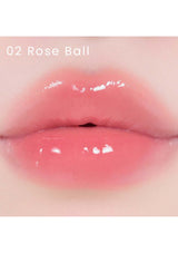 A collection of Alternative Stereo Lip Potion Sugar Glaze in various shades, displayed in small, clear bottles with pink labeling.