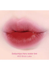Lip with Dailychips Haru water tint #03 Brick Lake on a close-up of lips.