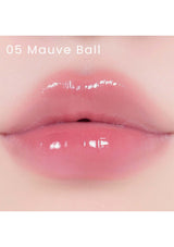 A collection of Alternative Stereo Lip Potion Sugar Glaze in various shades, displayed in small, clear bottles with pink labeling.