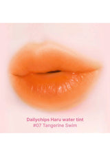 Lip with Dailychips Haru water tint #07 Tangerine Swim on a light pink background