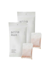 Three white packages with Korean text on a white background