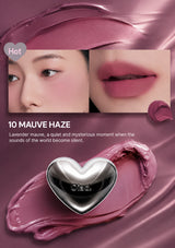 Lipstick with a heart-shaped cap on a white background, featuring the brand name.