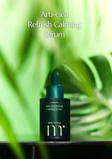 Arti-cica Refresh Calming Serum bottle with green leaves in the background