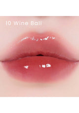 A collection of Alternative Stereo Lip Potion Sugar Glaze in various shades, displayed in small, clear bottles with pink labeling.