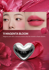 Lipstick with a heart-shaped design on a white background, featuring text about the shade '11 Magenta Bloom'.