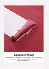 Pink lip balm on a red and white background with text about its formula.