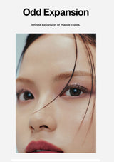 Close-up of a person's face with a focus on eye makeup, featuring the brand 'Odd Expansion'.