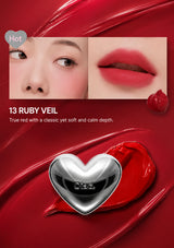 Lipstick with a heart-shaped cap labeled '13 Ruby Veil' on a white background.
