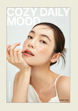 Woman with hand on face against a light background with 'Cozy Daily Mood' text.