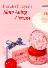 Flaner Tomato Tanghulu Slow Aging Cream with packaging on a pink background