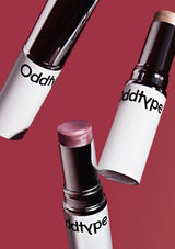 Three lipsticks with 'Oddtype' branding on a red background