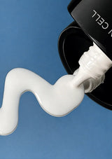 Milky texture dispensed from the BLANC DUBU Nuborn Cell black sunscreen bottle