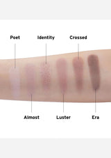 Swatch of six different makeup shades on a wrist with labels.