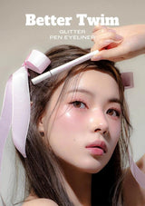Person applying glitter pen eyeliner with a focus on makeup product, branded 'Better Twim'.