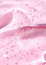 Close-up of pink slime with bubbles and a knife blade.