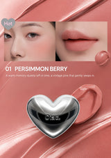 Lipstick with heart-shaped cap on a white background, showing color swatch and close-up of lips.