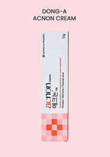 Dong-A Acnon Cream packaging on a pink background