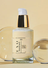 Skincare bottle labeled 'EXO' with a dropper on a beige background