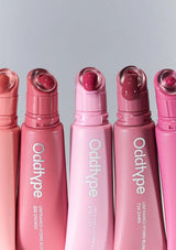 Set of pink bottles with caps, featuring the brand 'Odditype'.