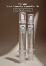 Two Vely Vely Prestige Collagen Age Ampoules on a beige background