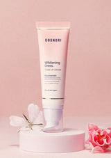 Cosnori Whitening Dress tube on a pink background with flowers