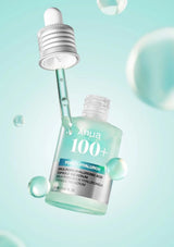 Ahuia 100+ serum bottle with dropper on a light blue background
