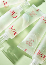 Clear skincare products including serum and cream on a light green background