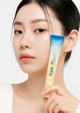Woman holding a tube of Ectoin skincare product against a white background