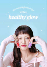 Woman holding lip products with text about moisturizing and glowing lips on a light blue background