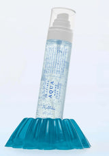 Skincare bottle labeled 'Aqua' on a white background