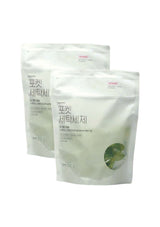 Two white bags with green leaf design on a white background