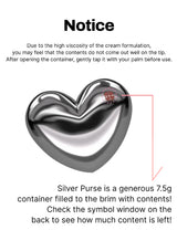 Silver heart-shaped container with text on a white background