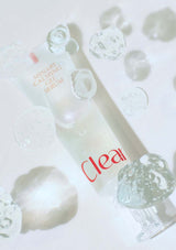 Skincare serum bottle with droplets on a light background