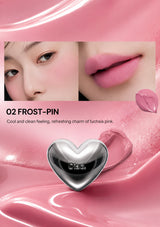 Lipstick with a heart-shaped cap on a white background, featuring a close-up of lips wearing the lipstick.