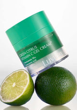 Green Citrus Vitamin C Gel Cream jar with a lime and lemon on a white background