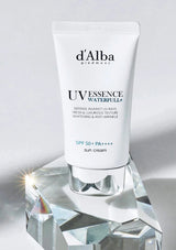 d'Alba UV Essence Waterfull+ sun cream on a crystal stand with a gray background