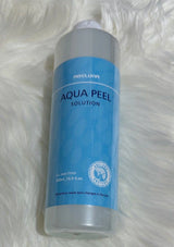 Aqua Peel solution bottle on a white fur background