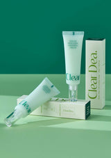 Clear Dea skincare products on a green background