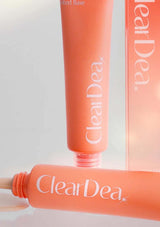 Orange ClearDea cosmetic tube on a light gray background