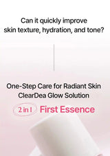 Promotional graphic for ClearDea Glow Solution 'First Essence' showing text about improving skin texture, hydration, and tone, with a partial view of a white cylindrical bottle at the bottom on a soft pink background.