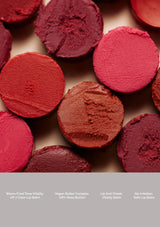 Red and pink makeup products on a beige background