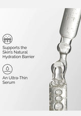 Close-up of an ampoule with text about supporting the skin's natural hydration barrier.