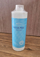 Bottle of Aqua Peel Solution on a wooden surface