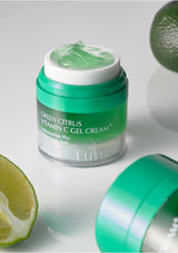 Jar of Green Citrus Vitamin C Gel Cream with a lime on a light gray background
