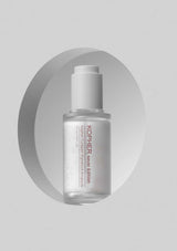 Kopher skincare serum bottle on a gray background