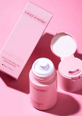 Pink skincare product with packaging on a pink background