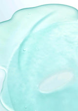 Close-up of a light blue, creamy substance on a white background
