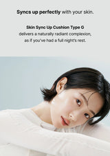 Woman with a natural makeup look against a light gray background, promoting a skin-syncing cushion type G product.
