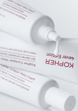 Kopher skincare product with white cream being squeezed out on a white background
